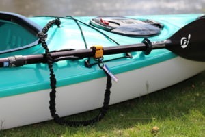 Paddle Leash attaching paddle to kayak